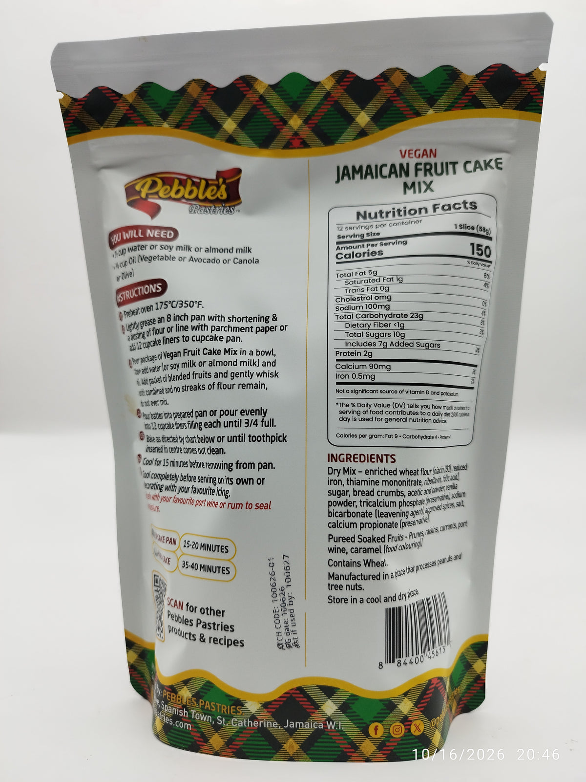 Back view of a Pebbles brand Vegan Jamaican Fruit Cake Mix bag, showing the nutrition facts panel, ingredients list, and product instructions on a white background.